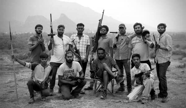 Arun-Madheswaran-poses-with-gun